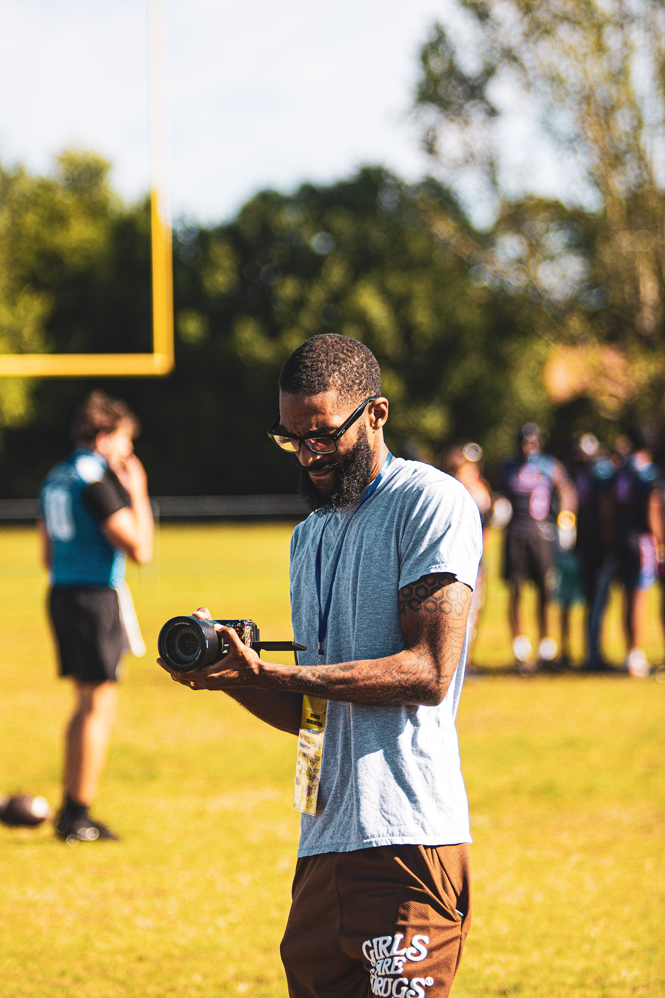 Stick reviewing footage on the sideline